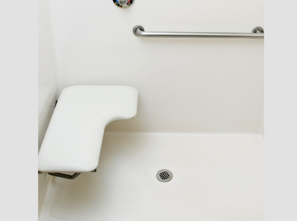 Image of a folding shower seat that's padded.