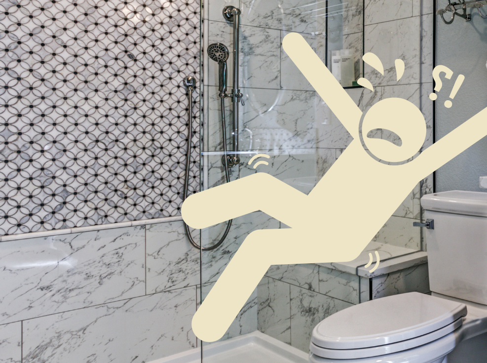 Picture of a tiled shower with a tiled seat behind a glass wall. A picture of a digital person sliding off the seat because it's too slick.
