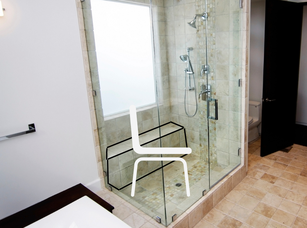 Image of a shower that has glass sides and a door. There is a seat in the back of the shower requiring someone to step into the shower. A digital image of a seat has been placed in front of the built in seat.